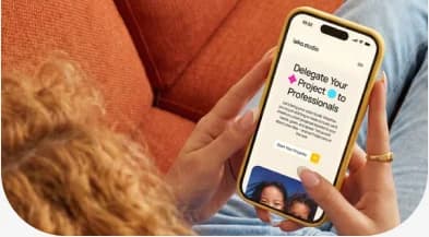 A church website open on a phone held over a couch
